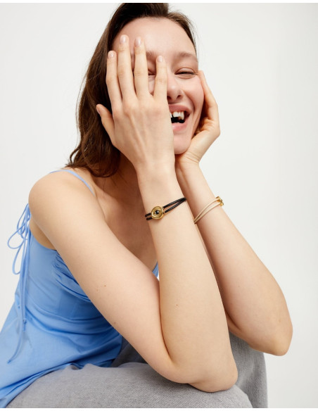 Pulsera de cuero negro con ojo dorado UNOde50